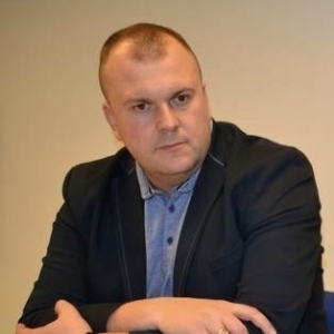 ADAM KOC